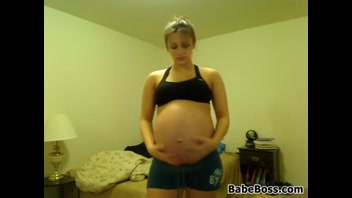 Sexy Pregnant Babe Strips Seductively Indoors