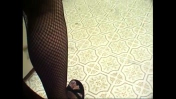 Naughty Elena in Fishnets Kneels for Double Action!