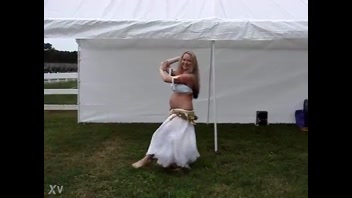Seductive Pregnant Belly Dancer Rocks the Drum!